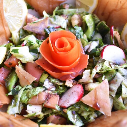 Fattoush salad (Lebanese salad) served and decorated with a tomato rose shape in the middle