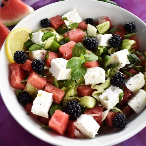 summer watermelon salad served in a white bowl
