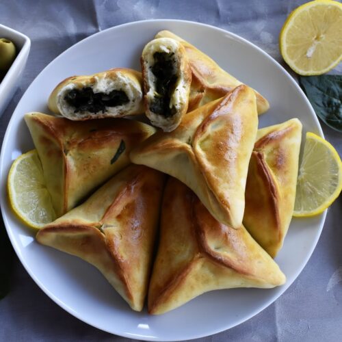 Discover the perfect homemade vegetarian spinach pies with flaky dough and flavorful spinach filling.