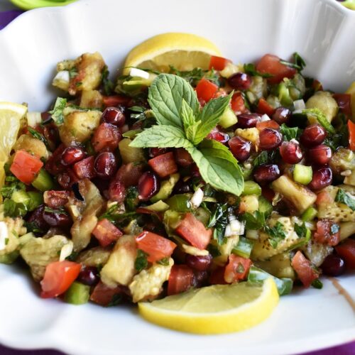 Lebanese Grilled Eggplant served in a white oval dish