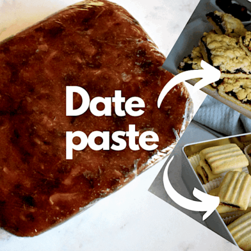 A log of smooth date paste wrapped tightly in plastic wrap, surrounded by whole dates on a light surface.