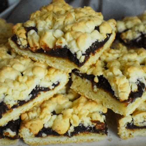 Date Squares of cookies filled inside with date paste, array and topped each others