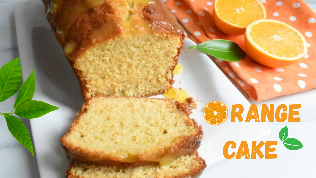 Moist pound orange cake glazed with orange sauce and served on a white plate, garnished with fresh orange slices on the side
